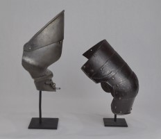 Stands holding a buffe that is normally secured to a breastplate and a kneStands holding a buffe that is normally secured to a breastplate and a knee